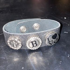 A Bracelet with a Cross,Letter B, and Love.